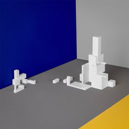 White geometric building blocks in various shapes and sizes, suitable for construction and architectural design.