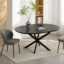  A round, extendable dining table with a black finish and a modern, minimalist design. The table features a sturdy, X-shaped base that provides a stable and stylish support. This versatile table can accommodate 4-6 people and is suitable for both casual and formal dining settings.