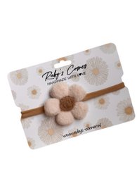  Cream-colored hair tie with a fluffy flower-shaped pom-pom accent, suitable for casual or formal wear.