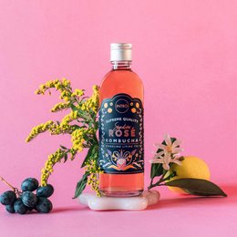 Signature Rosé Kombucha 0.33L - A refreshing rose-flavored kombucha with a vibrant pink color and floral notes.
