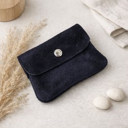 Dark blue suede mini wallet with coin pocket and snap closure.