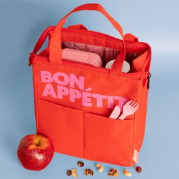 A red insulated lunch bag with the text "BON APPETIT" printed on it. The bag has a zipper closure and handles for carrying. It appears to be made of a durable, water-resistant material.