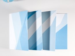 A set of greeting cards featuring a minimalist abstract design in shades of blue and white.