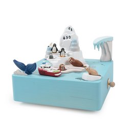 A whimsical Antarctic-themed music box featuring penguins, seals, and an iceberg-shaped design. The music box is made of colorful, textured materials and includes various animal figures.