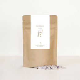 Bath salts in a kraft paper bag with a label that says "Salt Am so happy to have someone like you!". The bath salts appear to be a natural, organic product.