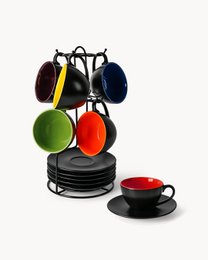 A set of colorful cappuccino cups in a modern, minimalist design. The cups feature a variety of vibrant colors including yellow, red, green, and blue. The cups are presented on a black metal stand, creating a stylish and functional coffee set.