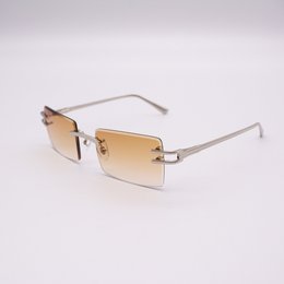 Rectangular gold-toned sunglasses with a sleek, modern design.