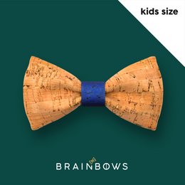A colorful, patterned kids' bow tie made of natural cork material. The bow tie features a blue center and a unique, textured cork design.