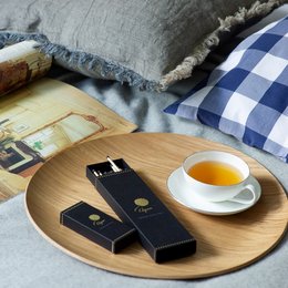 Long black scented matches in a wooden box, perfect for creating a cozy, hygge atmosphere.