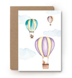 Colorful hot air balloons floating in the sky, depicted in a watercolor painting style. The image shows multiple balloons of various shapes and colors, creating a whimsical and serene scene.