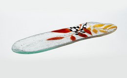  Rectangular serving tray with tropical leaf design in red, yellow, and black colors.