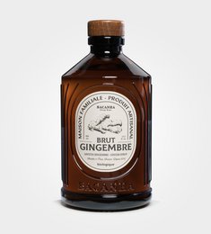 Bacanha - Ginger syrup, a lemonade product. The syrup is amber-colored and comes in a glass bottle with a wooden cap. The label prominently displays the product name "Bacanha - Ginger Syrup".