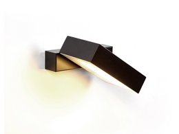 Black wall lamp with angular, minimalist design. Made of metal with a warm, directional light.