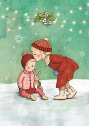  A Christmas card featuring two children standing under mistletoe, with a snowy background and twinkling lights.