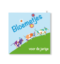  Colorful birthday card with playful cows, flowers, and cheerful Dutch text for children's celebrations.