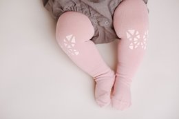Pink baby crawling tights with butterfly pattern, available in sizes 6-12 months and 12-18 months.
