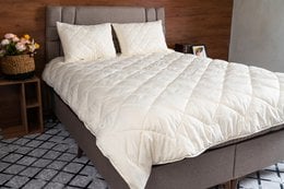 Merino wool duvet, available in various sizes, featuring a soft, cozy, and natural material for a comfortable sleep experience.
