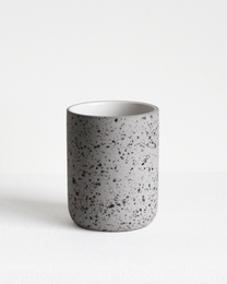 A speckled ceramic coffee mug with a capacity of 150 ml.