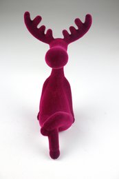 A plush, fuchsia-colored reindeer decoration with a round body and large antlers. The reindeer has a soft, flocked texture and measures approximately 22cm in height.