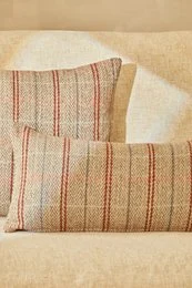 Striped wool cushion cover, cream and rust red vertical stripes, rectangular shape, natural texture.