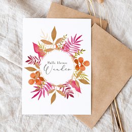 A colorful floral wreath card with the text "Hello there, darling" in the center. The card features a variety of leaves and flowers in shades of orange, pink, and blue.