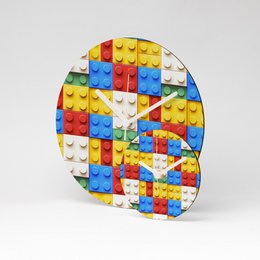  A round, multicolored wall clock made of MDF material with a diameter of 13cm or 26cm.