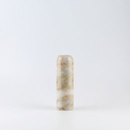 Marble candle holder with a cylindrical shape and a neutral, earthy color palette.