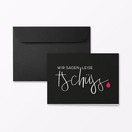 Folding condolence card in A6 landscape format, available in various color variants including neon foil orange, plain, glitter foil blue, and glitter foil silver/pink. The card features the handwritten text "Wir sagen leise Tschüss" (We say goodbye quietly) with a small heart icon.