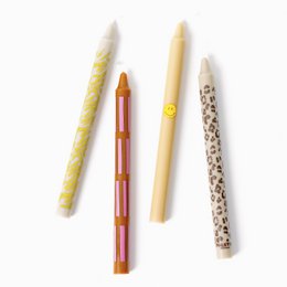 Set of 4 retro-style dinner candles in various colors and patterns, including solid colors, stripes, and a textured design.