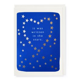 "Anniversary greeting card with a heart-shaped design of stars against a blue background and the text 'It was written in the stars.'"