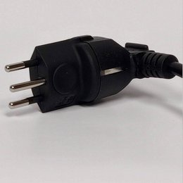 A black electrical plug transducer for use with kettles. The plug has three prongs and a cord attached, indicating it is designed for electrical appliances.