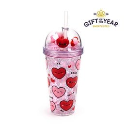 Pink double-walled travel cup with red hearts, straw, and charms. Heart-shaped designs.