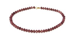  Necklace made of natural stone beads in shades of purple and brown.