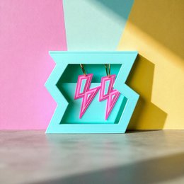  Mint turquoise stud earrings with pink lightning bolt design, neon flash style geometric shape.