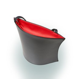 A small, black shoulder bag with a red interior. The bag has a simple, minimalist design and appears to be made of a durable material.