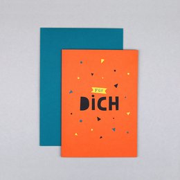 Congratulations card with the text "Dich" in a bold, stylized font against an orange background with scattered triangles. The card is paired with a teal-colored card.