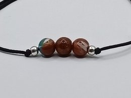 Bracciale con pietre preziose a flusso d'oro