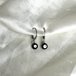 Black hoop earrings with evil eye charm, made of metal.