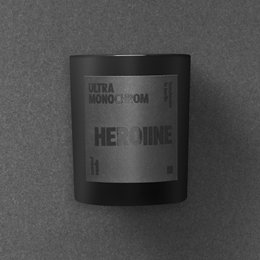 Small, scented candle with a black label that says "Heroine".