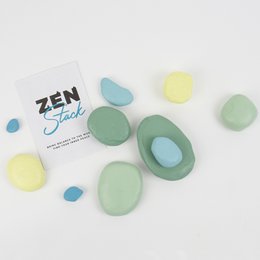 Zen art stacking game with smooth, colorful stones in various shades of green, blue, and yellow. Stones can be stacked in different configurations to create calming, meditative displays.