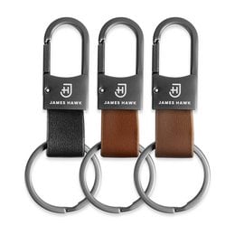 Leather keychain in black, brown, and camel colors with a metal ring for attaching to keys or bags.