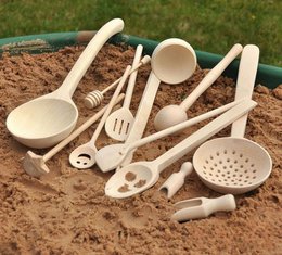  A set of 12 wooden kitchen utensils including ladles, spoons, and skimmers for a play kitchen.