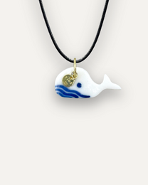 Porcelain pendant in the shape of a blue whale with gold-tone accents.
