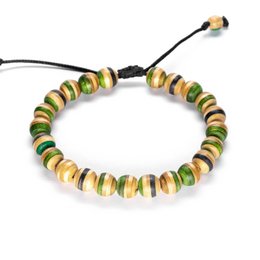 Colorful bracelet made from recycled skateboards with a mix of green, yellow, and brown beads.