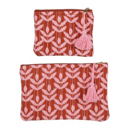  Two pink and red patterned toiletry bags with tassels.