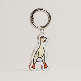  Dog leash keychain with standing dog charm, metal ring attachment, cream and brown colors, pet accessory.