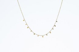  Gold delicate chain necklace with small dangling charms, minimalist jewelry design