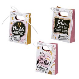  White gift bags with colorful text and illustrations, containing candies and Prosecco. The bags feature phrases like "Mach's Besser" and "Du bist Krasse". The bags appear to be part of a gift set or party favor.