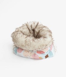 Soft, plush pet basket made of canvas and faux fur, available in medium and small sizes, featuring a colorful patterned design.