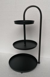 Black metal decorative tray with two circular platforms and a curved handle.